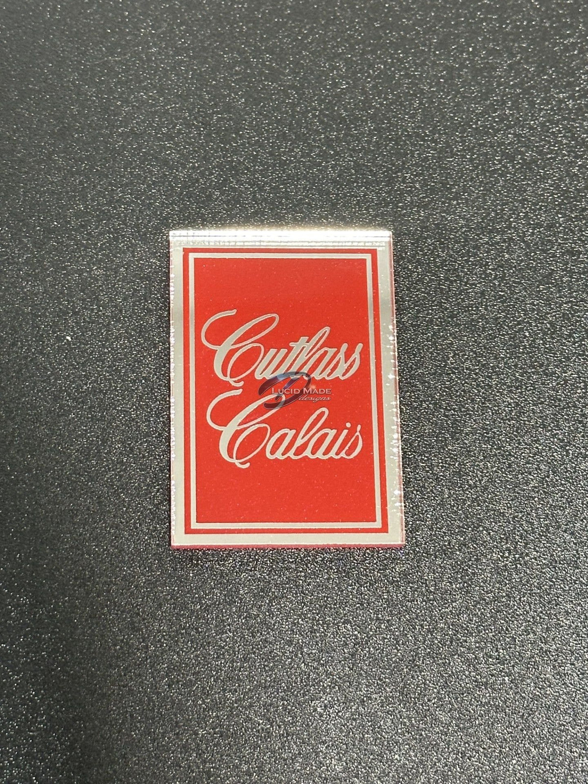 1978 1979 Oldsmobile Cutlass Calais Header Panel Emblem Red Metallic and Chrome