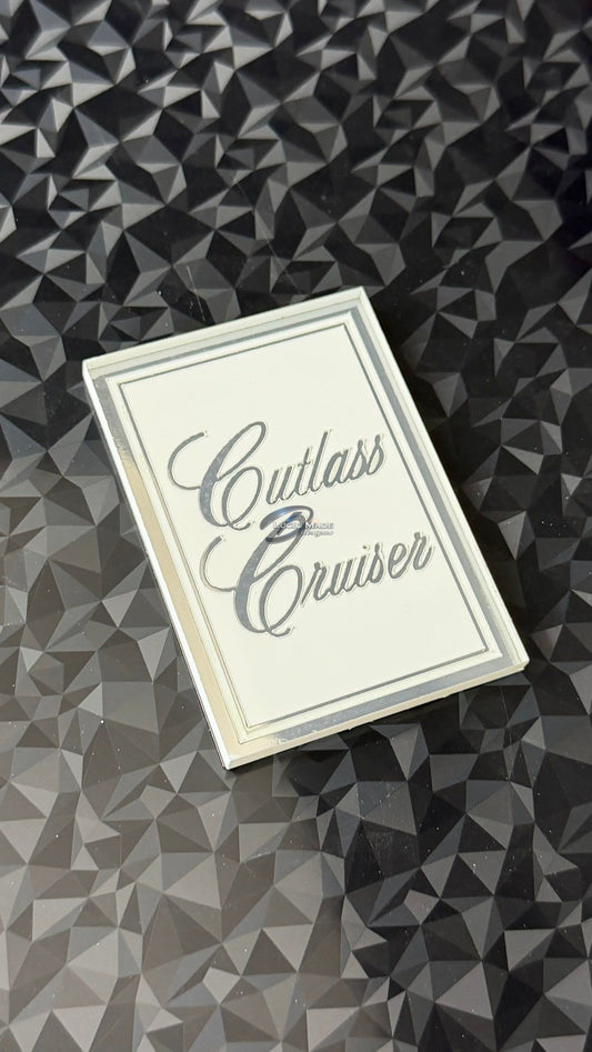 1978 1979 Oldsmobile Cutlass Cruiser Header Panel Emblem White and Chrome