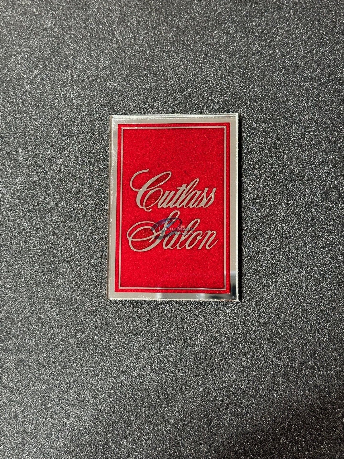 1978 1979 Oldsmobile Cutlass Salon Header Panel Emblem Red Metallic and Chrome
