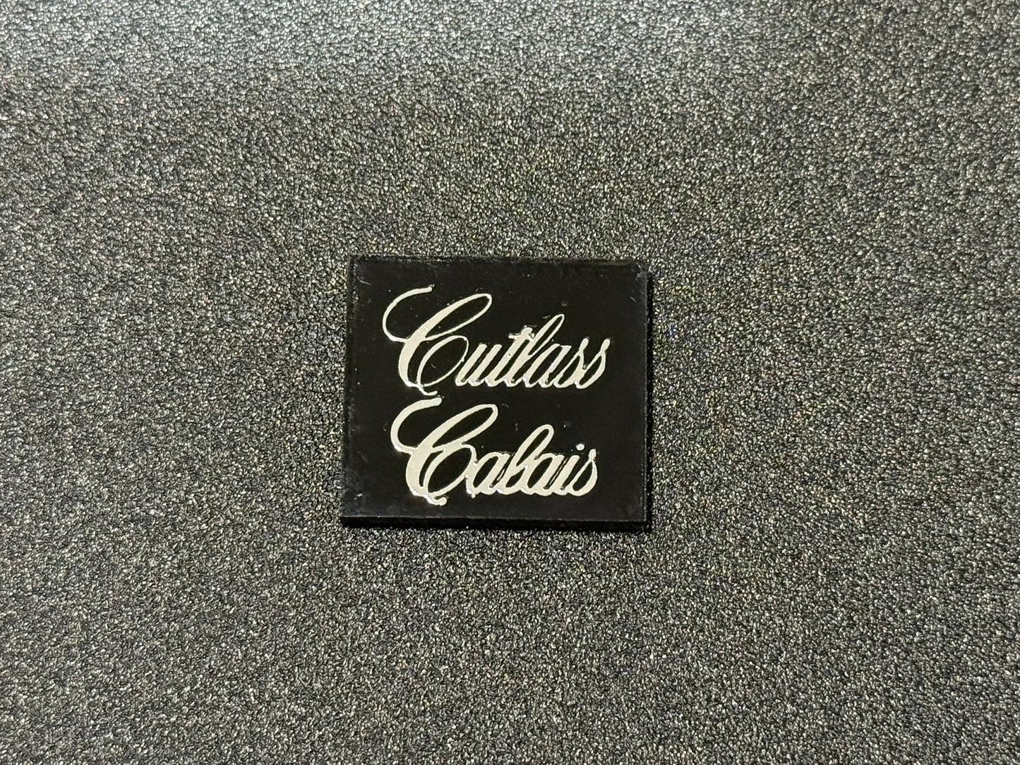 Oldsmobile Cutlass Calais Trunk Lock Cover Insert Emblem Reproduction Black and Chrome