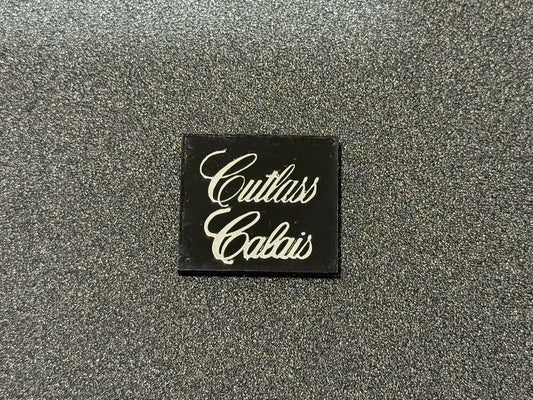 Oldsmobile Cutlass Calais Trunk Lock Cover Insert Emblem Reproduction Black and Chrome