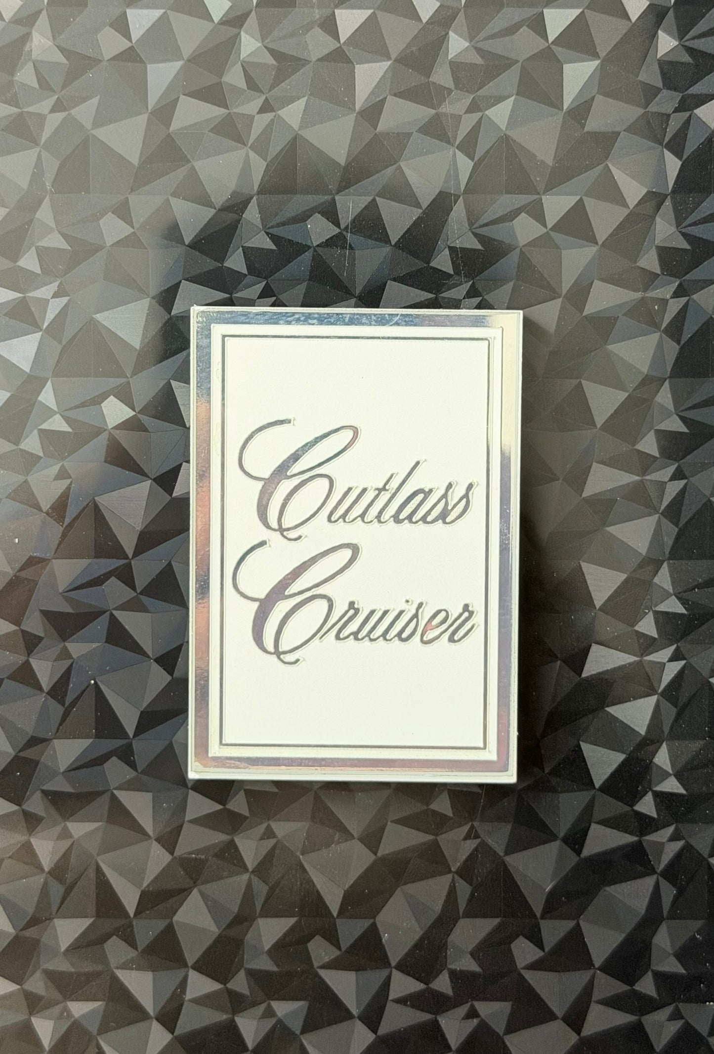 1978 1979 Oldsmobile Cutlass Cruiser Header Panel Emblem White and Chrome